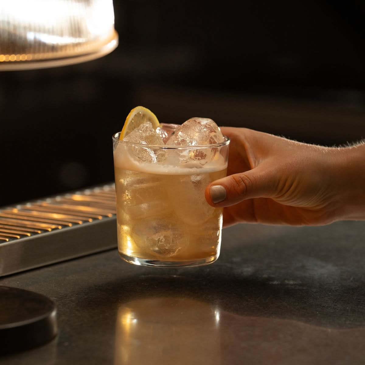 Amaretto Sour shaken to perfection and poured over ice and garnished with a lemon wheel