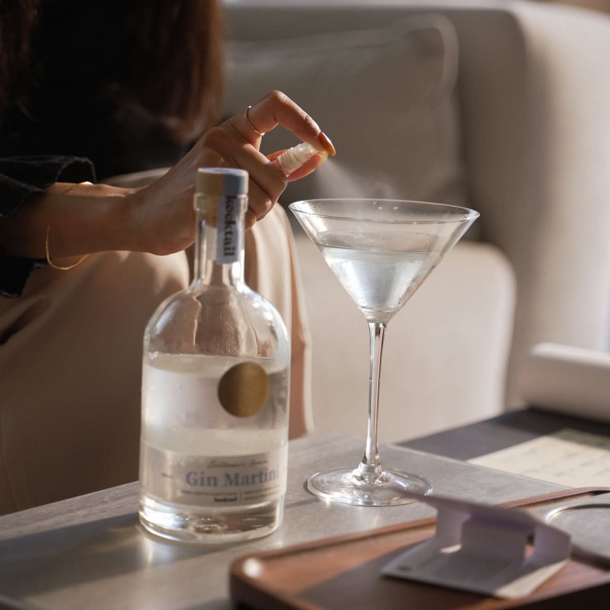 Bartender’s Reserve Gin Martini served on a candlelit table indoors – refined evening cocktail setting