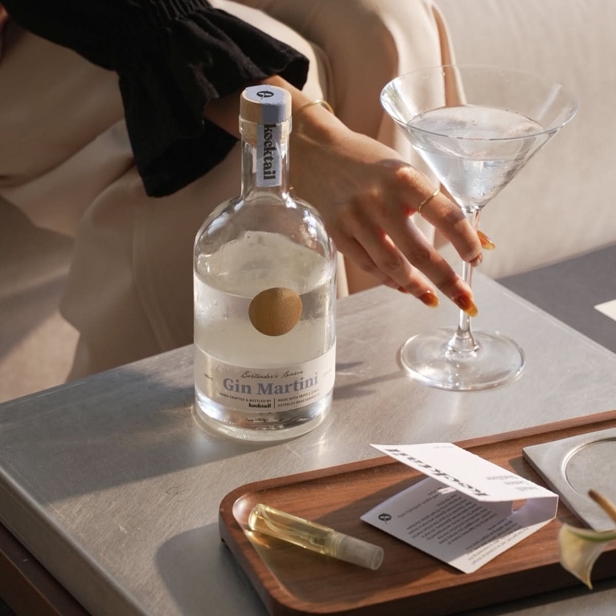 Sipping a Kocktail Gin Martini in a cosy evening setting – freezer martini with a touch of luxury