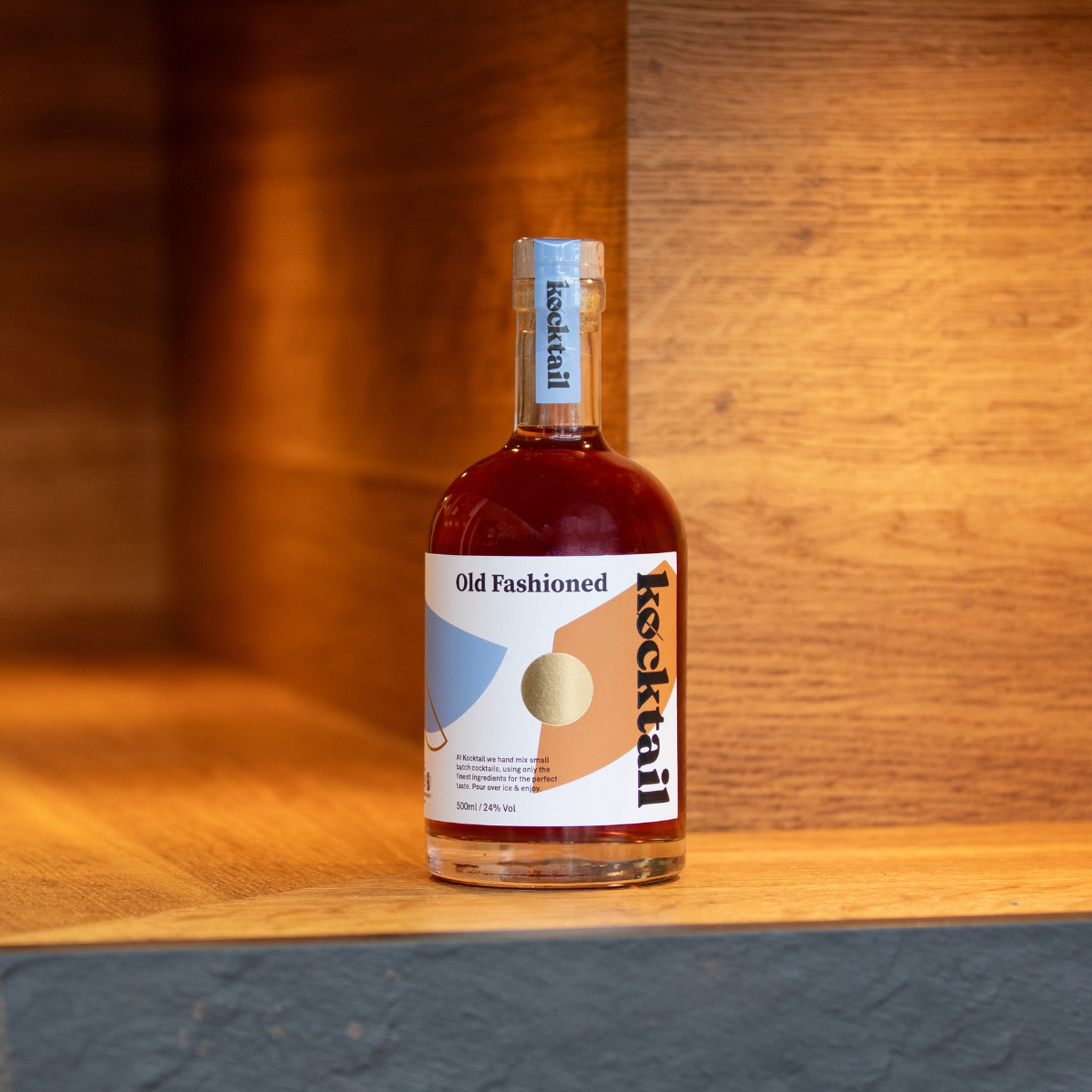 Bottled Old Fashioned cocktail by Kocktail, showcasing bold bourbon blend in a sleek, minimal presentation